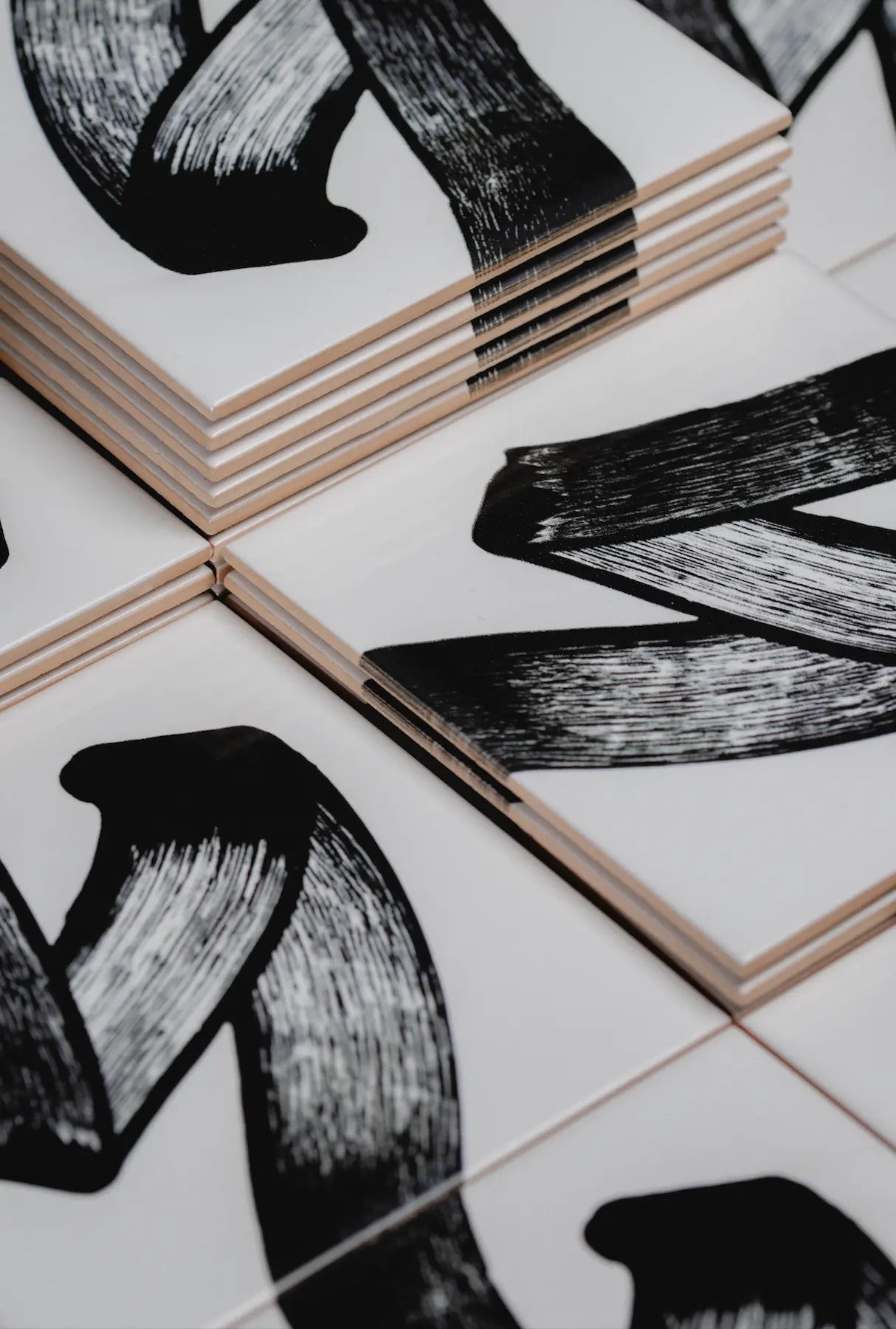 Angled shot of JonOne First Series ceramic tile artwork by Clay highlighting abstract pattern – available on Clay