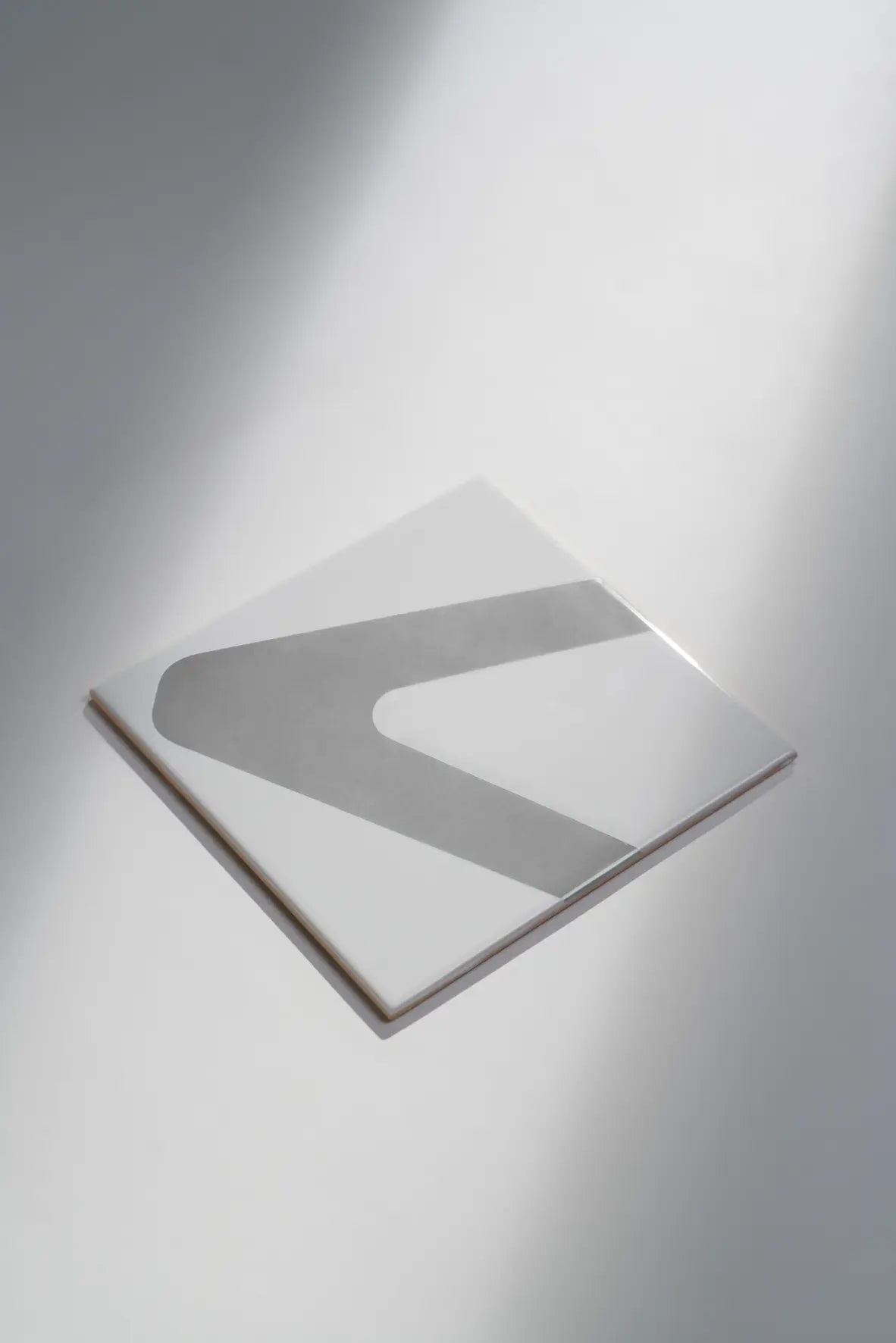 Close-up of Pattern Clay Originals 1 ceramic tile by Clay in soft grey – shop exclusively at Clay