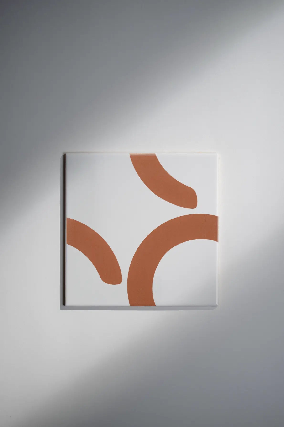 Pattern Clay Originals 2 ceramic tile by Clay in terracotta orange with flowing curved design – on sale at Clay