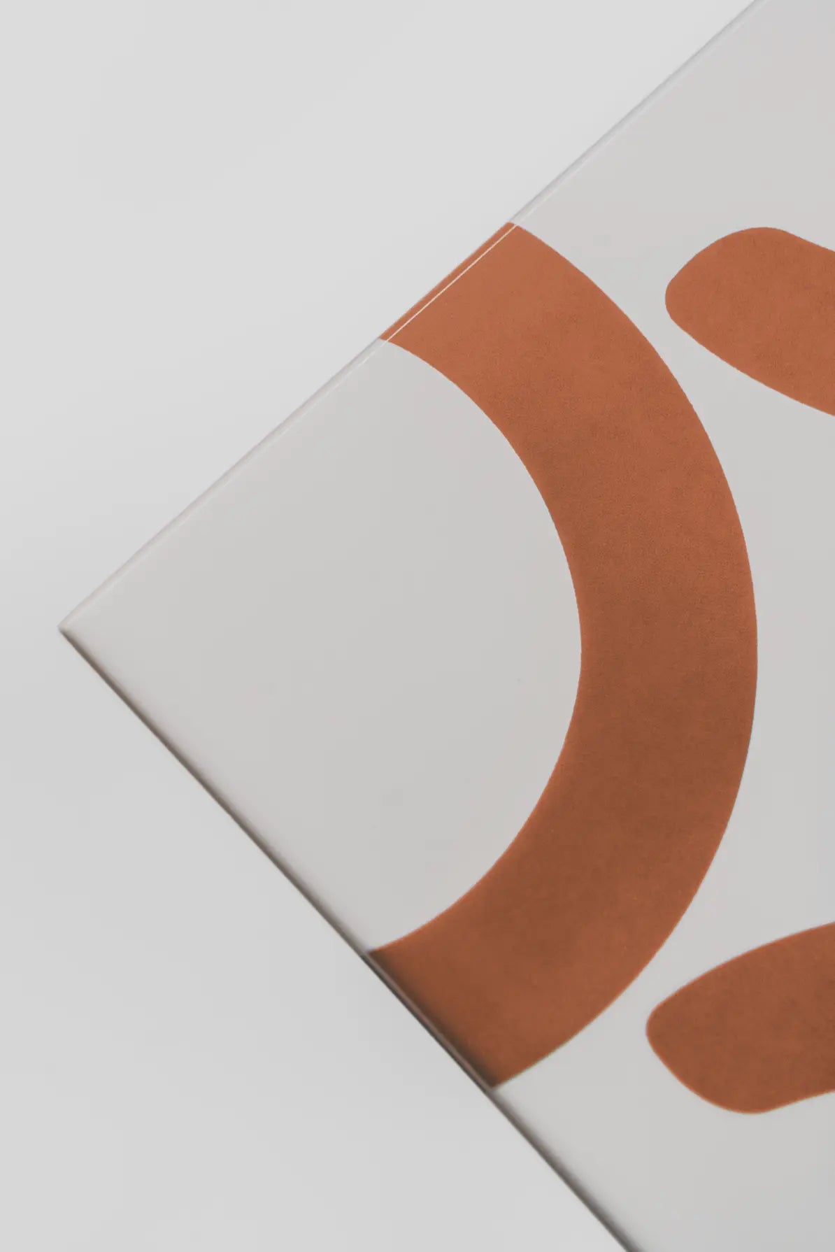 Angled view of Pattern Clay Originals 2 ceramic tile by Clay in brown – available on Clay