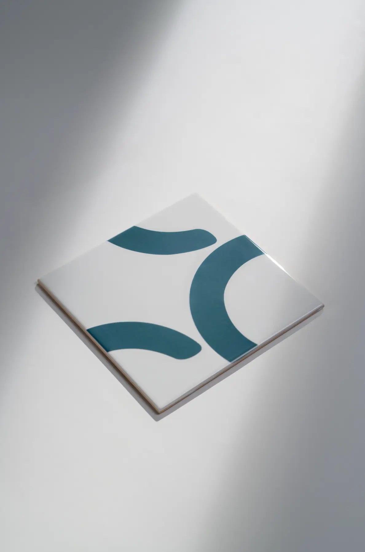 Angled view of Pattern Clay Originals 2 ceramic tile by Clay in teal – available on Clay