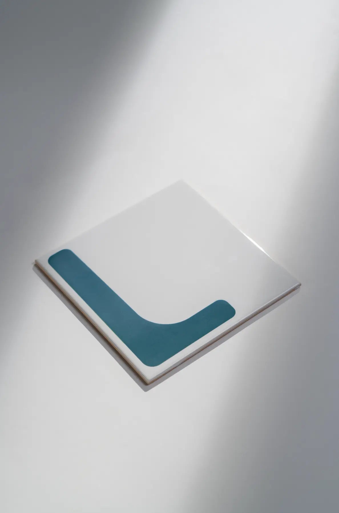 Angled view of Pattern Clay Originals 3 ceramic tile by Clay in teal – available on Clay