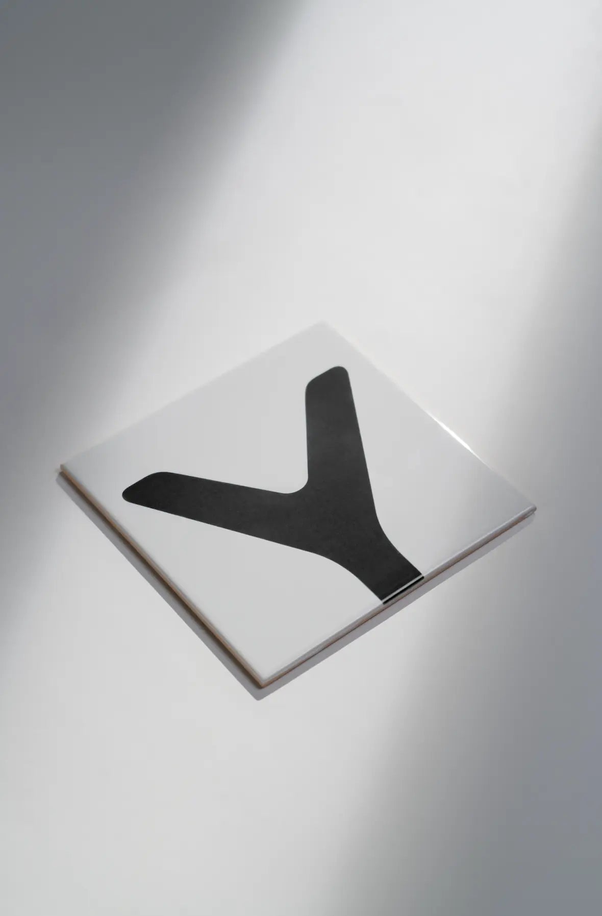 Angled view of Pattern Clay Originals 4 ceramic tile by Clay in black – available exclusively on Clay