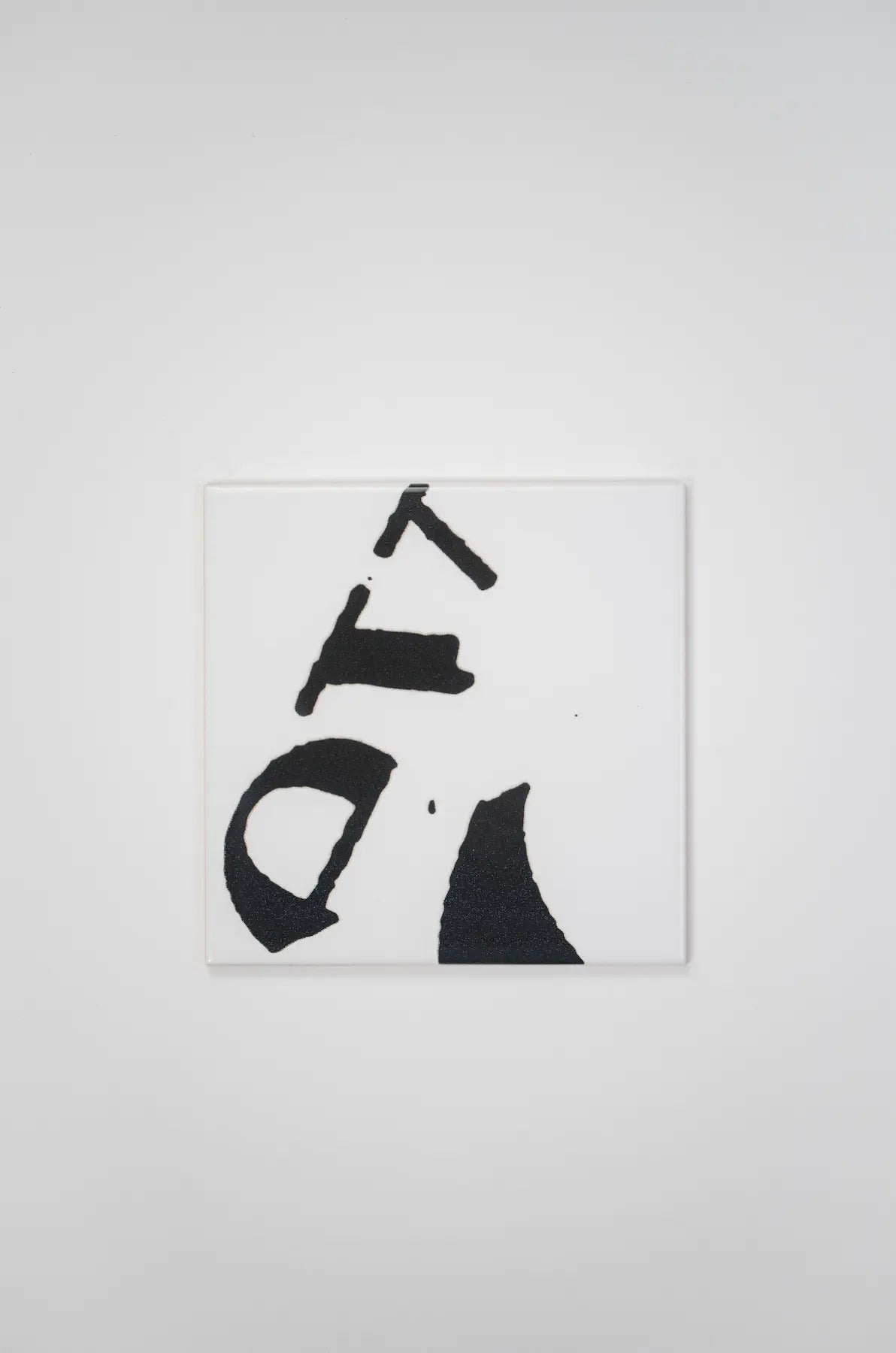 Pattern VHILS ceramic tile by Clay with fragmented black and white letter design – available exclusively on Clay