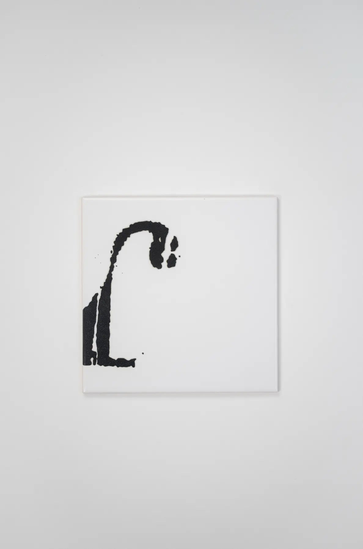 Pattern VHILS ceramic tile by Clay with black letter typography – available at Clay