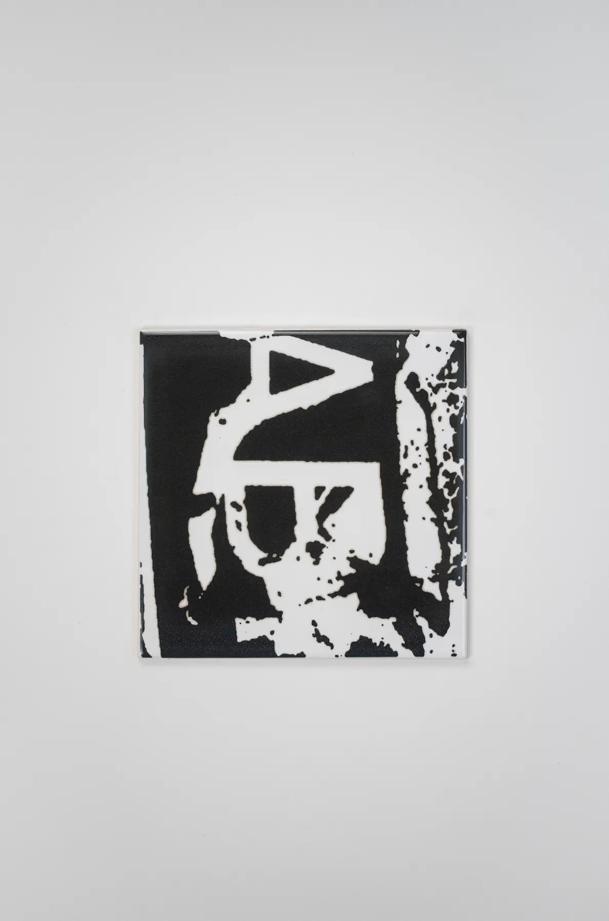 Pattern VHILS ceramic tile by Clay with collage-style typography – on sale at Clay